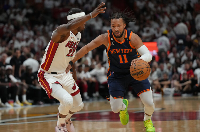 May 12, 2023; Miami, Florida, USA; New York Knicks guard Jalen Brunson (11) brings the ball up the court as Miami Heat forward Jimmy Butler (22) defends in the first half during game six of the 2023 NBA playoffs at Kaseya Center. Mandatory Credit: Jim Rassol-USA TODAY Sports